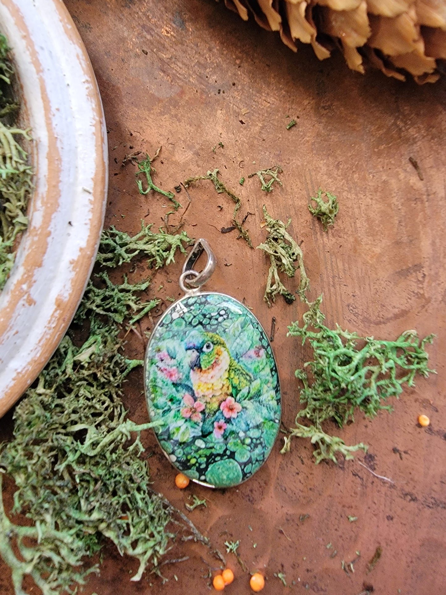 Green cheek conure on jasper pendant