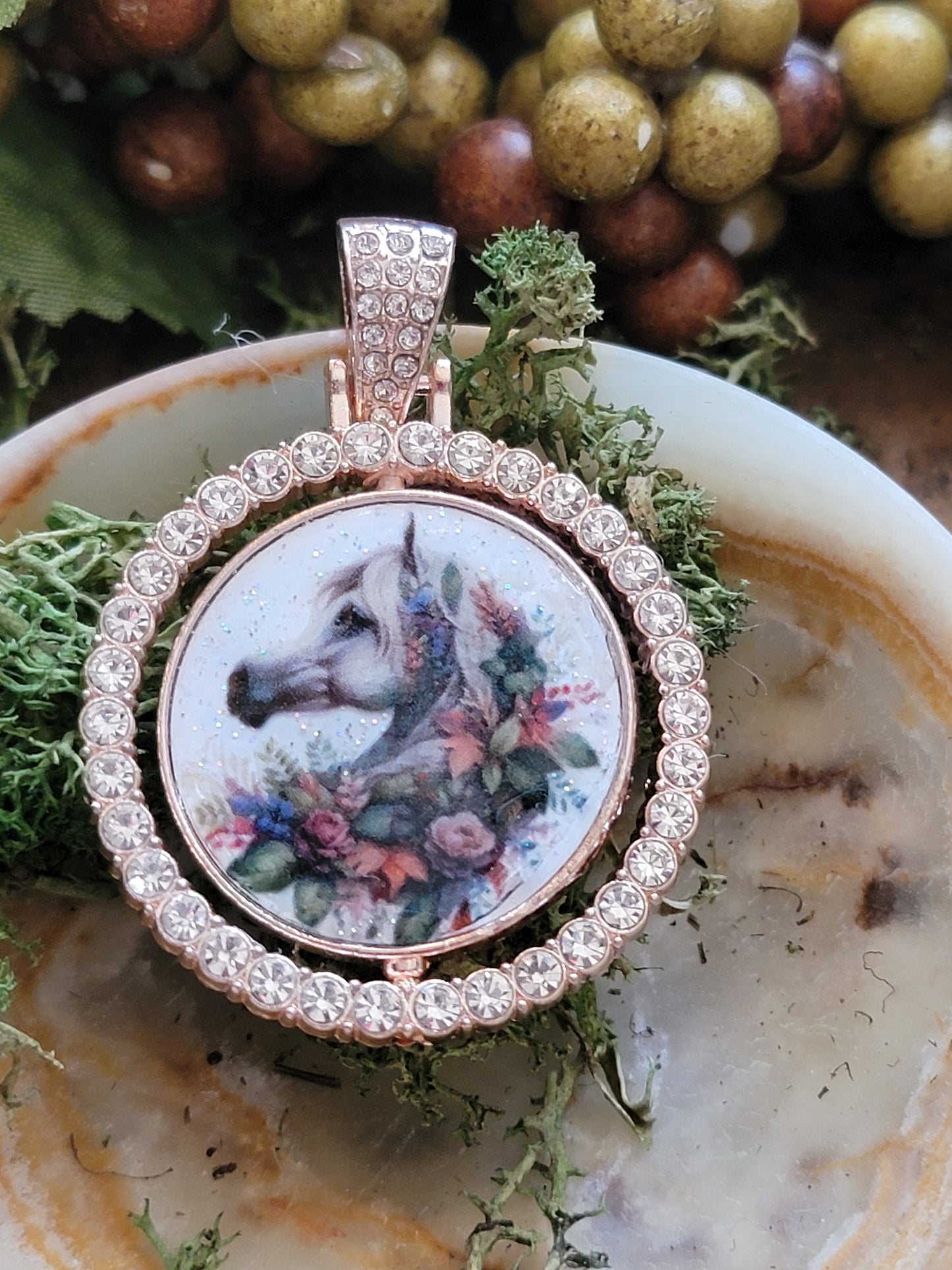 Rose gold rhinestone Arabian horse floral pendant rotating